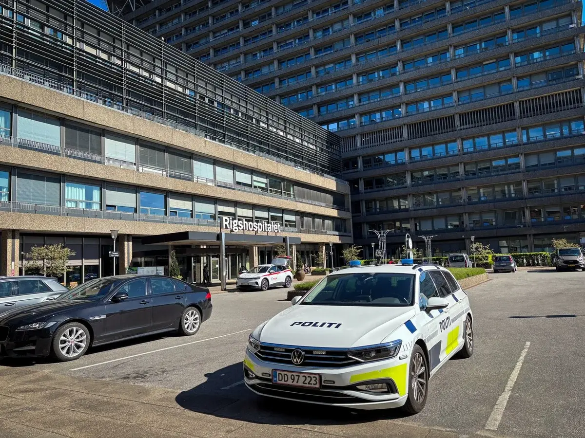 Danish police car parked outside Rigshospitalet hospital entrance