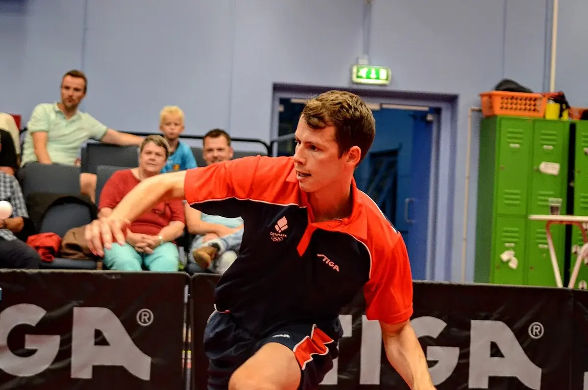 Jonathan Groth playing table tennis in a competition.