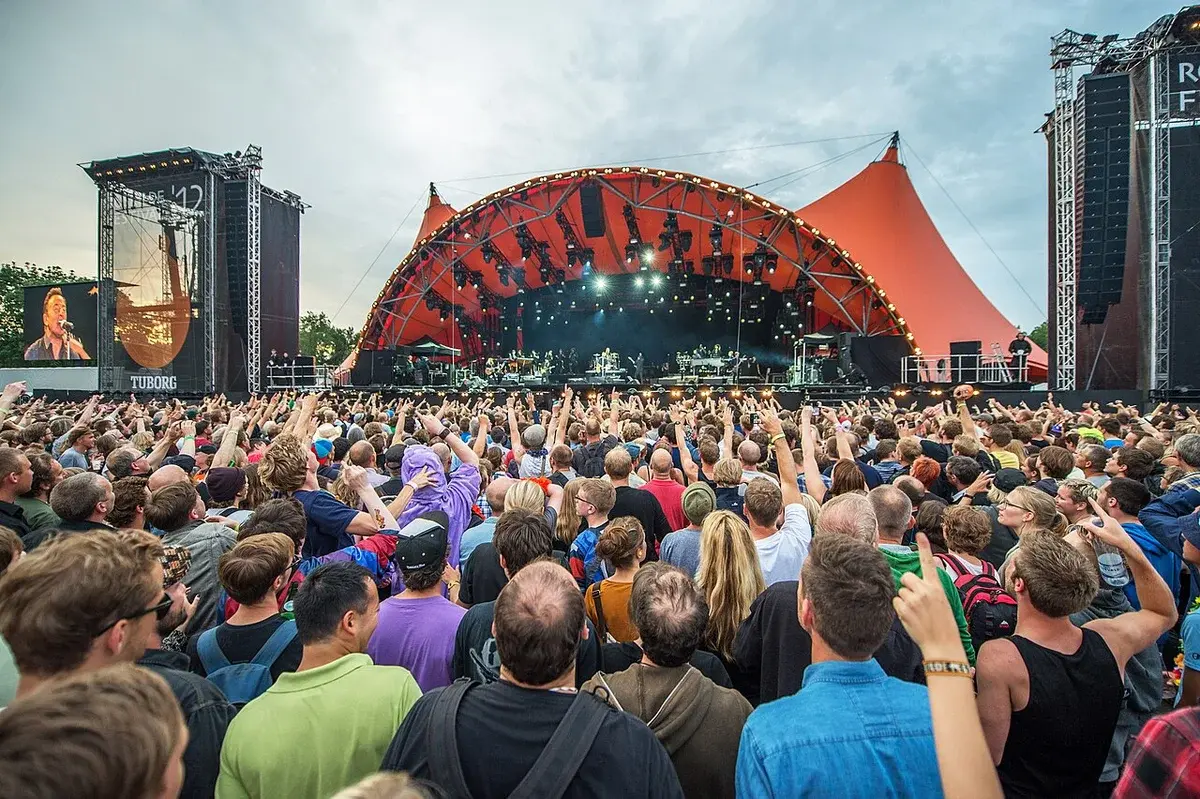 Crowd watching concert at Roskilde Festival Orange Stage