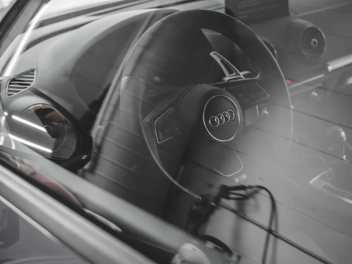 Audi interior viewed through a car window