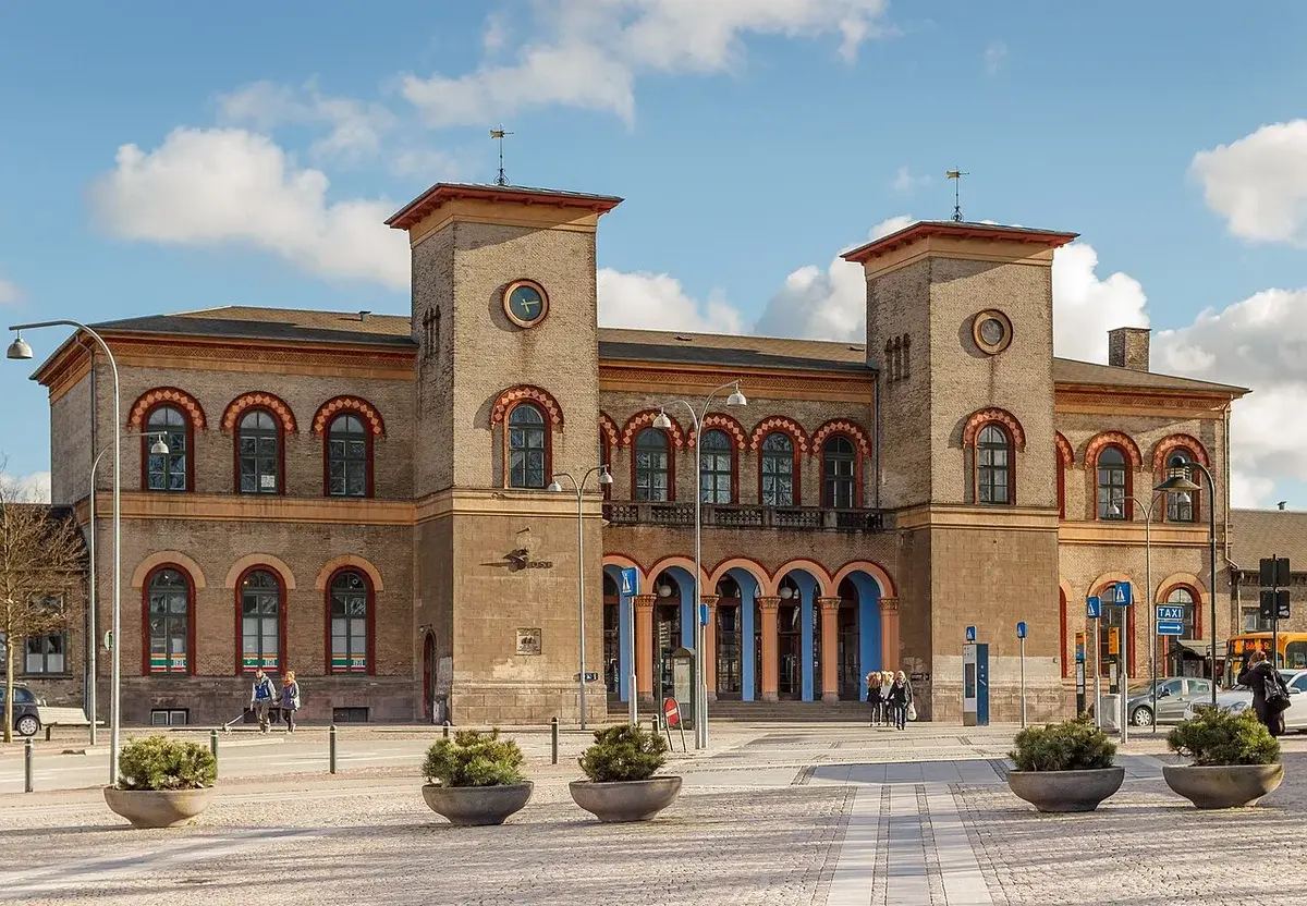 Front view of Roskilde Station building with clock towers